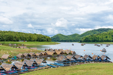 Bamboo raft shelter are floating restaurant in the middle of water under the blue sky as a tourist attraction at Huai Krathing Reservoir, Loei province, Thailand