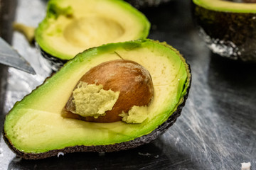 Male Chef Pealing Avocado for  Wedding Meal