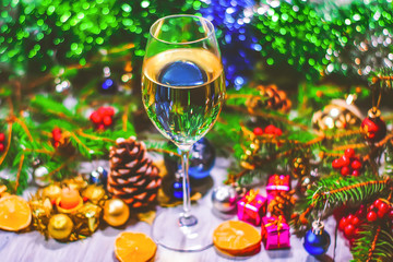 a glass of champagne or white wine on a new year background, Christmas decorations