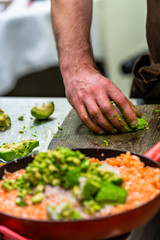 Male Chef Slicing Avocado for  Wedding Meal