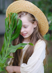 portrait of little girl outdoors in summer