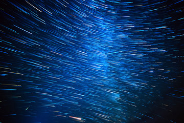 Night sky with lot of shiny star trails. Abstract natural astro background.