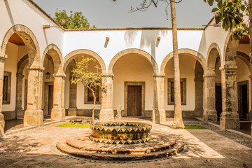 Courtyard of the Cabanas Cultural Institute with its vaulted corridors, arches and a fountain, a...