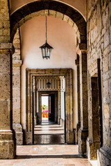 Internal corridor with its pillars and stone arches of the Cabañas Cultural Institute, illuminated...