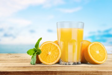 Orange juice and slices of orange on background © BillionPhotos.com