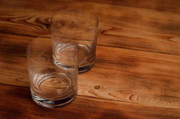 Glasses for whiskey on a wooden table