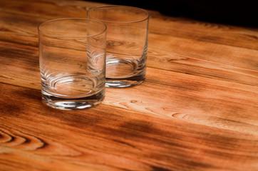 Glasses for whiskey on a wooden table