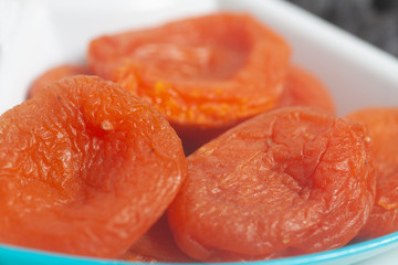 Dried apricots on white plate