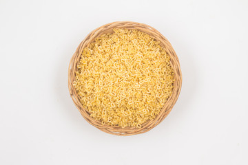 Letter-shaped pasta in a basket bowl