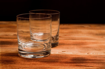 Glasses for whiskey on a wooden table