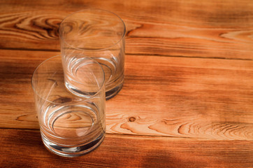 Glasses for whiskey on a wooden table