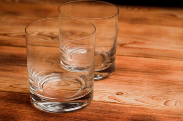 Glasses for whiskey on a wooden table
