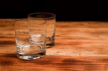 Glasses for whiskey on a wooden table