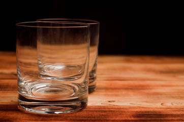 Glasses for whiskey on a wooden table