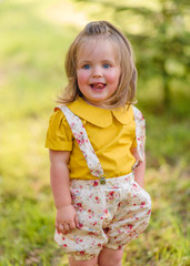 portrait of little girl outdoors in summer