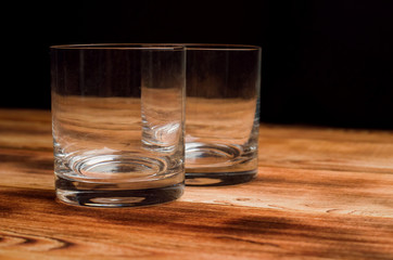 Glasses for whiskey on a wooden table
