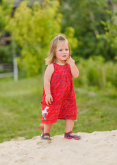 portrait of little girl outdoors in summer