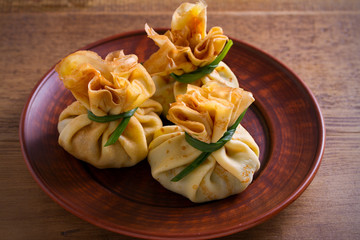Savory crepes with mushrooms and onion. Bags of pancakes stuffed with mushrooms. horizontal