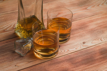 Glasses for whiskey on a wooden table