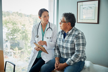 Doctor speaks with male patient