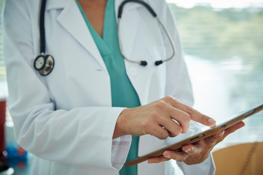 Doctor touching a tablet