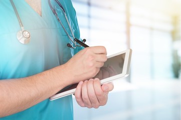 Close-up Doctor at hospital working with tablet