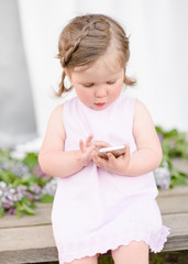 portrait of little girl outdoors in summer