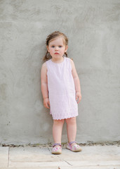 portrait of little girl outdoors in summer