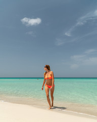 Fototapeta na wymiar Blonde girl on the Varadero beach, Cuba.