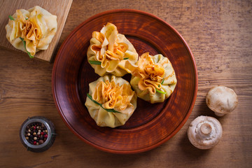 Savory crepes with mushrooms and onion. Bags of pancakes stuffed with mushrooms. overhead, horizontal