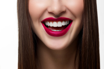 Fototapeta premium Perfect smile after bleaching. Dental care and whitening teeth. Stomatology and beauty care. Woman smiling with great teeth. Cheerful female smile with fresh clear skin and pink lips