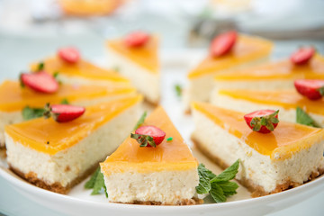 Delicious, juicy, fresh yellow cake with fresh strawberries