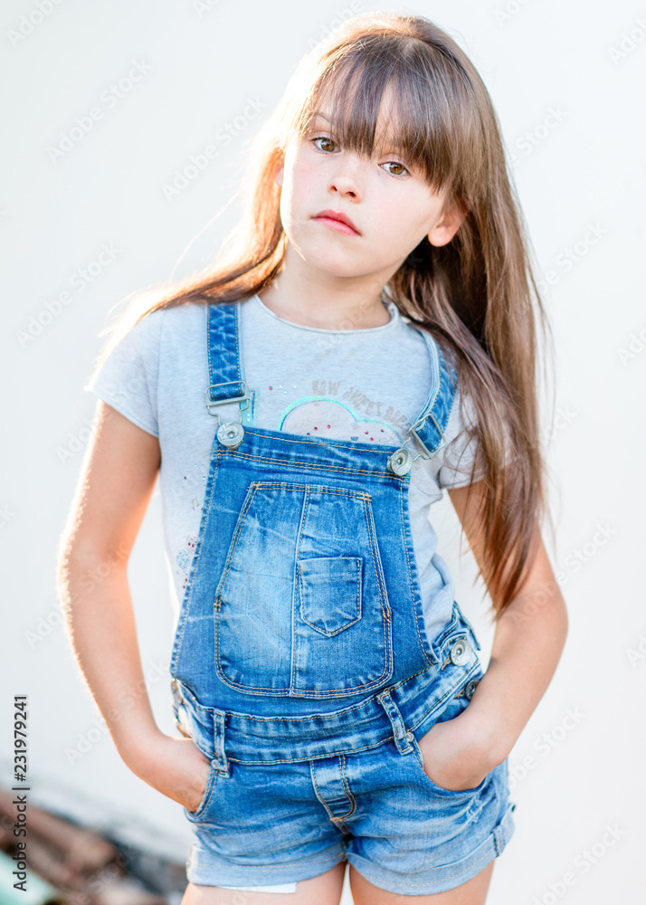 Wall mural portrait of little girl outdoors in summer