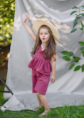 portrait of little girl outdoors in summer