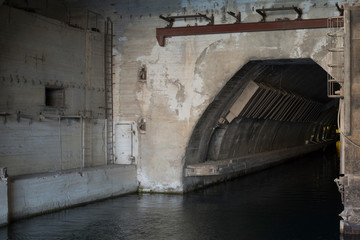 the entrance to the concrete bunker with the entrance from the water side. entry for ships