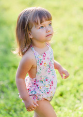 portrait of little girl outdoors in summer