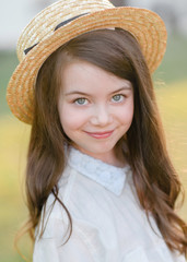 portrait of little girl outdoors in summer