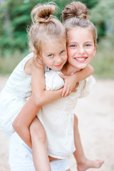 Portrait of two girls in the woods girlfriends