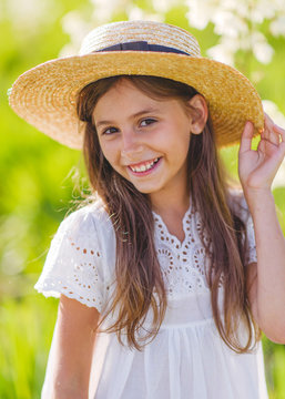 portrait of little girl outdoors in summer