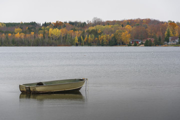Fishing boat Fall scene on lake