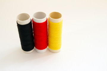 Coils of thread in the shape of the flag of Germany