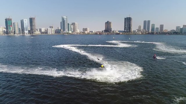 Aerial view of jet ski making a fast turn during the race in Khalid lake in Sharjah, U.A.E.