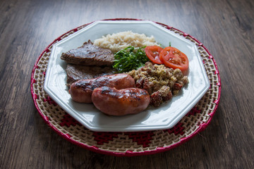 Brazilian food dish - barbecue, rice and beans