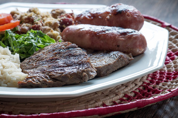 Brazilian food dish - barbecue, rice and beans