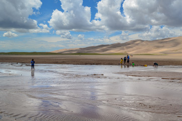Fototapeta na wymiar Stream before the dunes at Great Sand Dunes National Park, CO