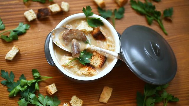 soup puree with mushrooms and croutons in an bowl