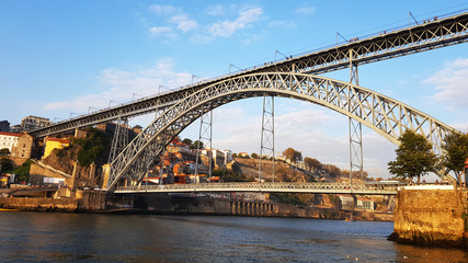 Fototapeta na wymiar View of the Dom Luis I Bridge and Douro river from Vila Nova de Gaia in Porto, Portugal