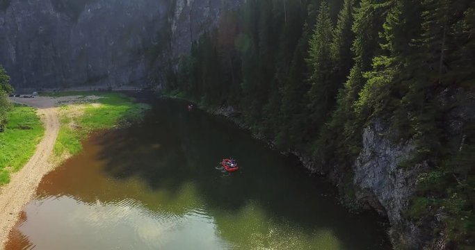 Epic Rafting Two Orange Boat on Shallow Mountain Forest Zilim River in Ural Mountains, Russia at summer sunny day - Aerial view