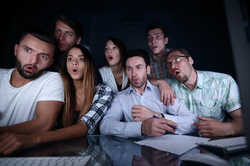 Fototapeta premium surprised business team looking at the computer monitor