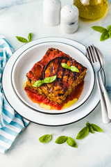 gluten free vegan lasagna. from grilled eggplant, green peas, lentils and vegetables. delicious healthy comfort food for the whole family for the holidays. italian parmigiana